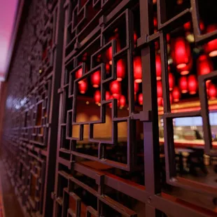 a view of a bar with red lights