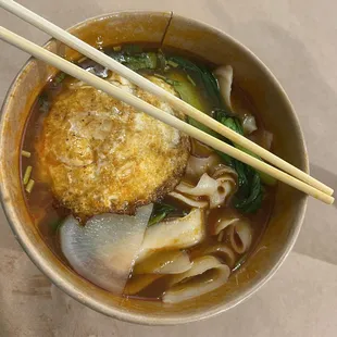 Tomato soup with hand cut noodles, veg, and fried egg.