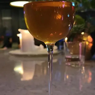 a glass of wine on a table