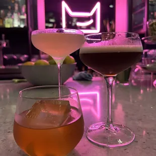two cocktails on a bar