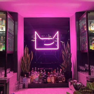 a neon sign in a bar