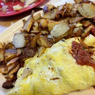Bacon sausage Swiss cheese omelette with well done home fries