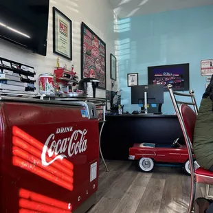 Some Coca Cola memorabilia and a TV while you wait