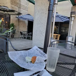 a glass of milk and a sandwich on a table