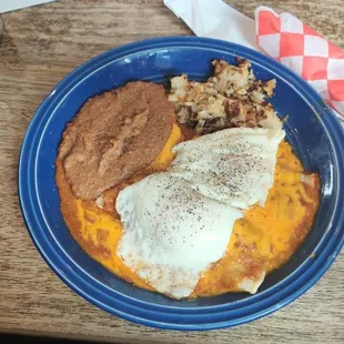 Eggs over enchiladas