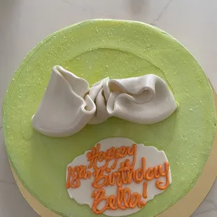 a birthday cake with a bow