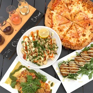 Wine flight board, cheese pizza, crab cakes, scallops, (clockwise) and calamari (in the middle).