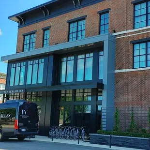 a van parked in front of the hotel