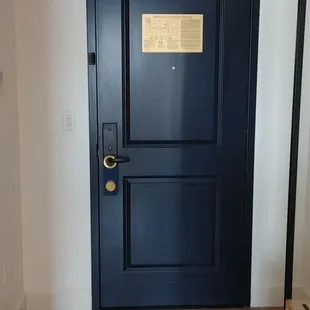 a blue door in a hallway