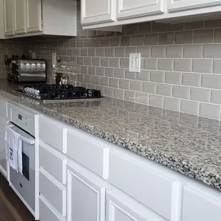 Countertop, and backsplash by Michael Flooring Inc.