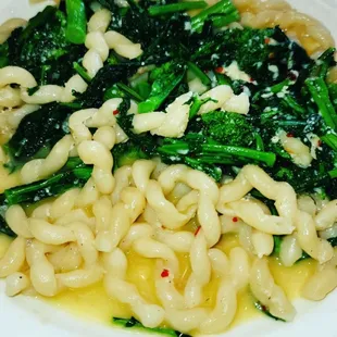 Broccoli Rabe and Fusilli pasta in a buttery garlic and sauce with romano cheese