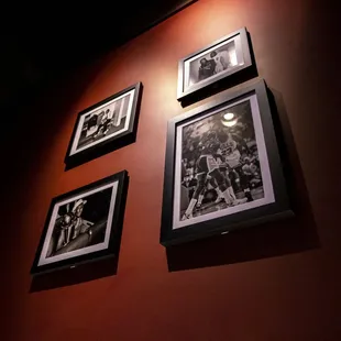 a wall of framed photos