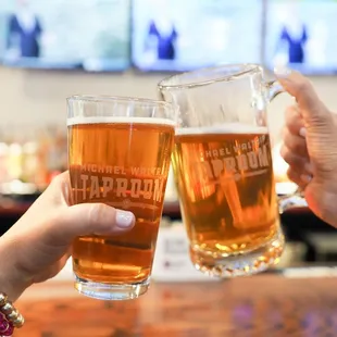 two people toasting at a bar