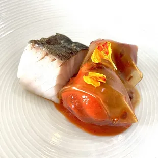 Black cod with strawberry kimchi, ramps, harissa gelée, and cod caramel