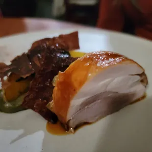 a plate of food with meat and sauce