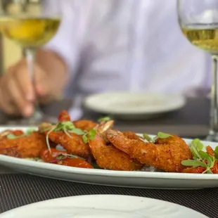 a plate of food and a glass of wine