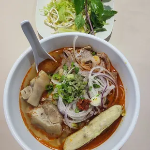 a bowl of soup and a plate of salad