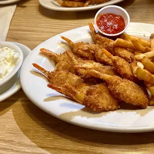 Breaded Shrimp Dinner of 12 jumbo breaded shrimp with cocktail sauce, coleslaw and fries.