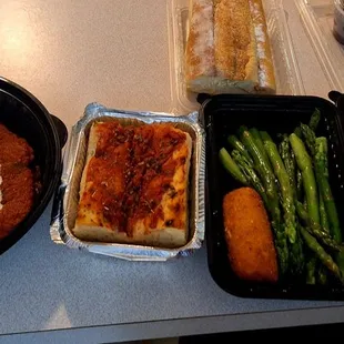 What arrived when I ordered chicken parm w. side of pasta: Italian bread, foccaccia, asparagus, potato croquette, fresh parmesan, olives.
