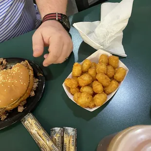 a hamburger and tater tots