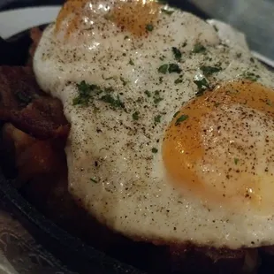 Roc-doc tater tots - cheddar, ranch goat cheese, bacon,&amp; chipotle - avocado crema, &amp; 2 fried eggs.  Perfect.