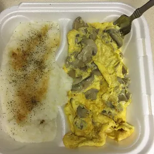 Mushroom and Cheese Omelette with grits on left that I added garlic powder and pepper to