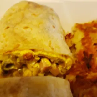 a breakfast burrito and hash browns