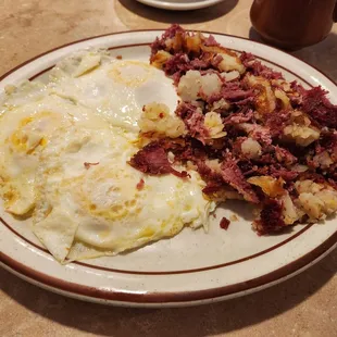 Best corned beef hash ever, served with potatoes, 3 over medium eggs and choice if toast, English muffin, etc., but I passed on the bread!!