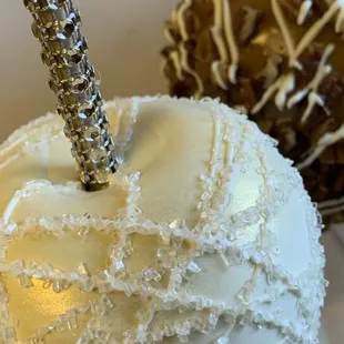 a close up of a white chocolate covered apple