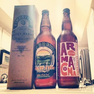 two bottles of beer on a counter
