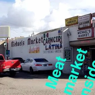 a red truck parked in front of a store