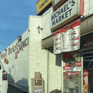 a white van parked in front of a store