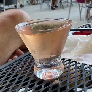 a glass of wine on a table