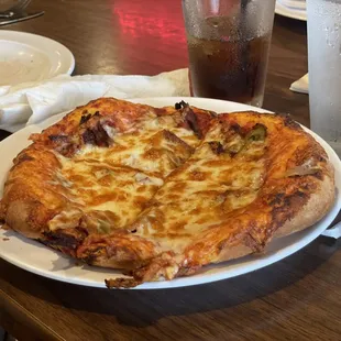 Philly cheesesteak pizza. You can't see all the Philly Fixin's but they are there underneath the cheese.