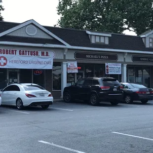 cars parked in front of a restaurant