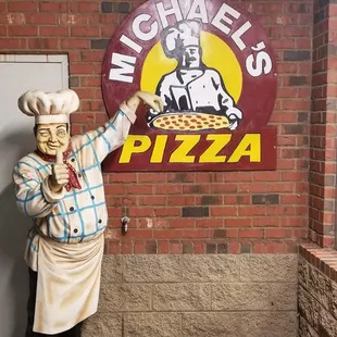 a statue of a chef