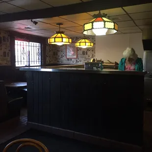 a woman sitting at the counter
