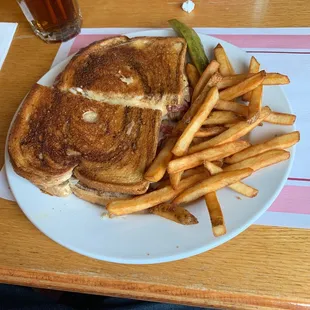 a grilled cheese sandwich and french fries