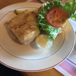 a sandwich with lettuce and tomato