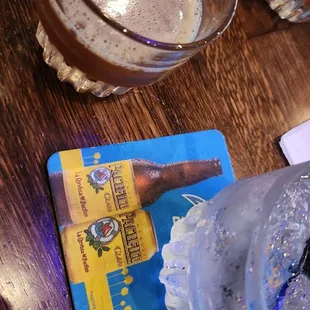 a glass of beer and a credit card
