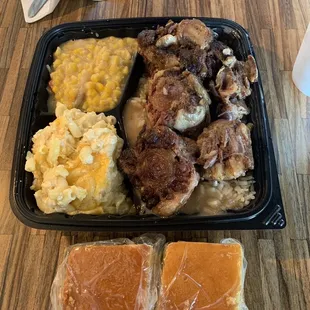 Oxtails with mac n cheese, creamed corn, and cornbread