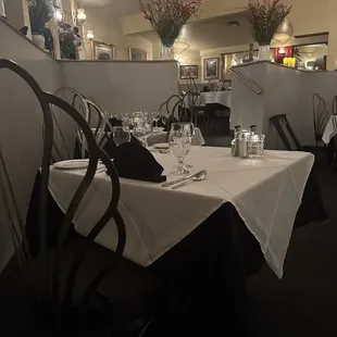 a dining room with tables and chairs