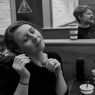 Motherhood is full of chaos and it is these moments we want to remember. This mom&apos;s son is adding a barrette to mom&apos;s hair.
