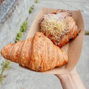 Plain croissant and dark chocolate pistachio croissant