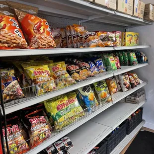 a shelf of chips and snacks