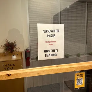 a sign on a glass door