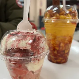 a cup of ice cream with a spoon sticking out of it