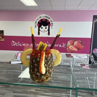 a pineapple with fruit in it
