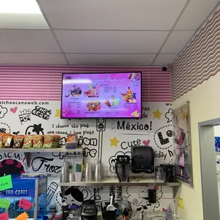a tv mounted above the counter