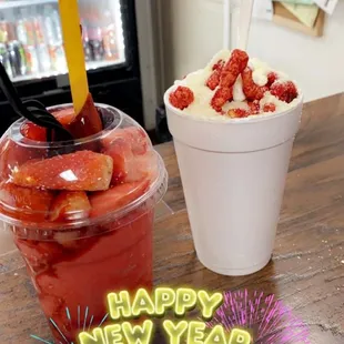 two cups of ice cream and strawberries